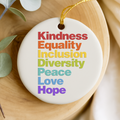 Decorative ornament with motivational phrases on a wooden surface with greenery
